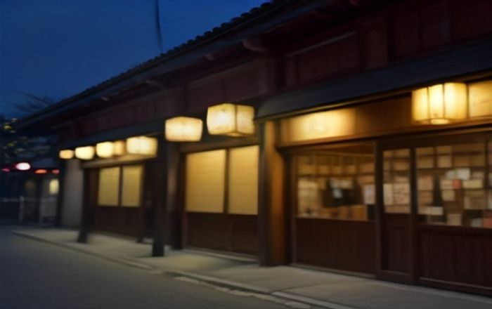 东京新宿一家日本私人影院门店外观夜景，霓虹招牌与排队入口清晰可见